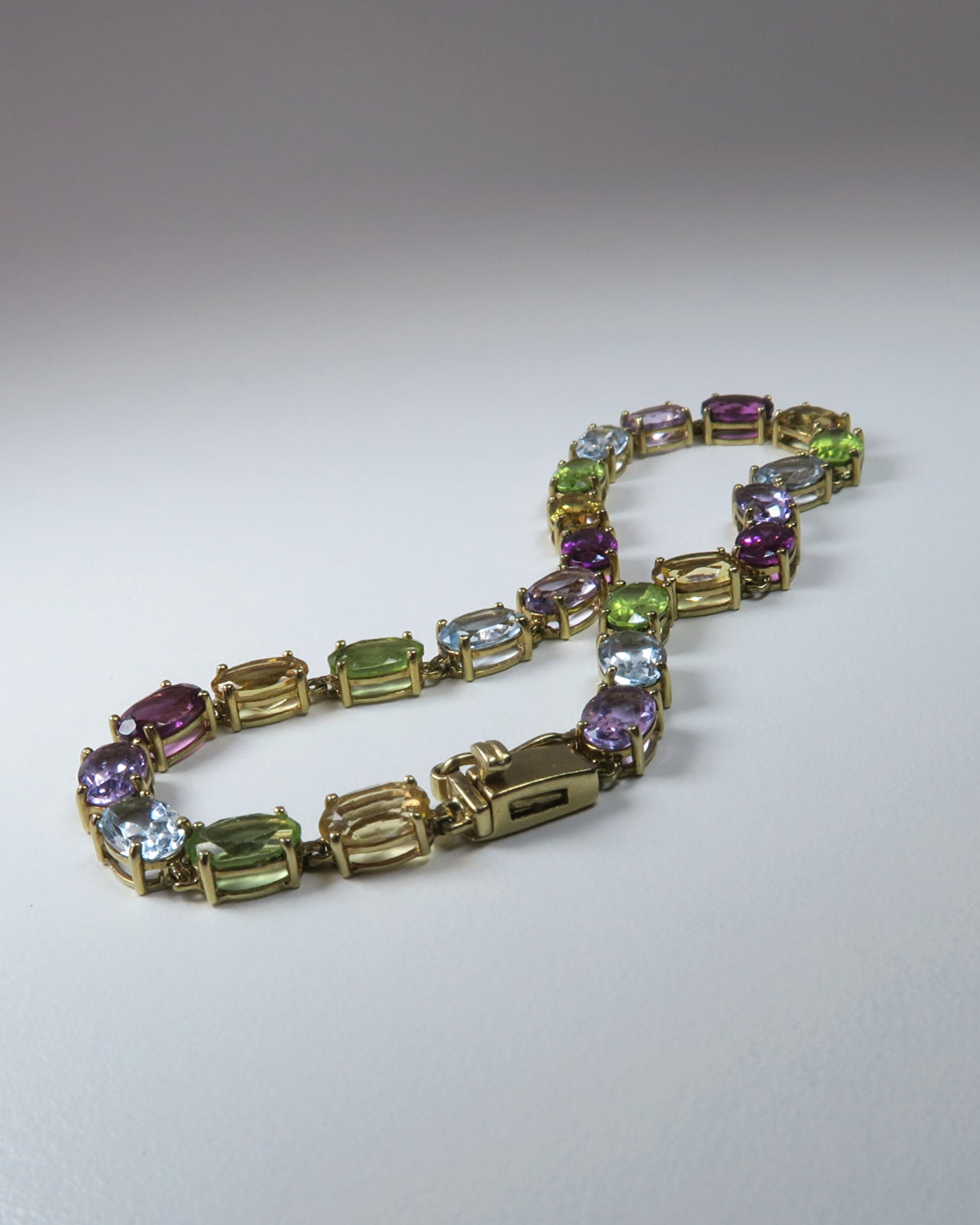 9CT GOLD MULTI‑GEMSTONE BRACELET