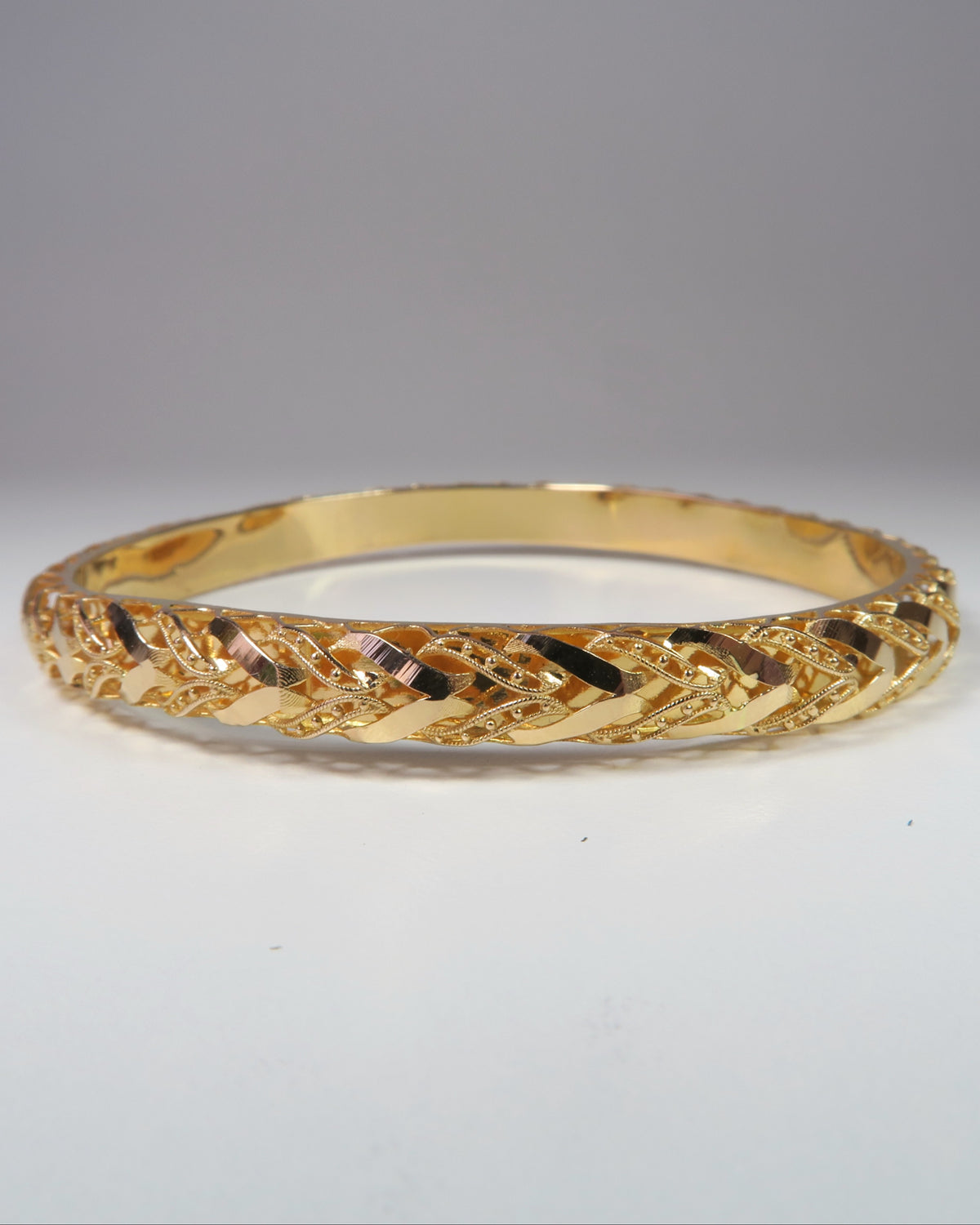 21CT ROSE GOLD BANGLE - 8.89 GRAMS